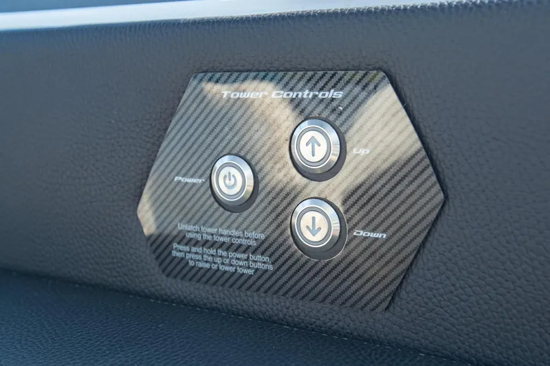 Slide: The Image of 2022 Nautique Super Air Nautique G25 tower controls with power, up, and down buttons. - 36