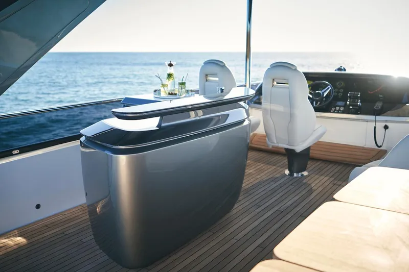 Slide: The Image of Luxurious 2025 Princess Y72 Motor Yacht interior with ocean view and modern seating. - 13