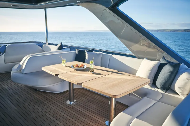 Slide: The Image of Luxurious 2025 Princess Y72 Motor Yacht deck with elegant seating and ocean view. - 14