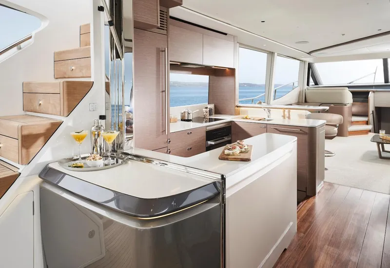 Slide: The Image of Luxurious interior of 2025 Princess Y72 Motor Yacht with modern kitchen and ocean view. - 21