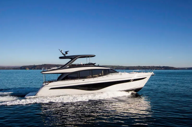 Slide: The Image of 2025 Princess Y72 Motor Yacht cruising on open water under clear blue skies. - 3