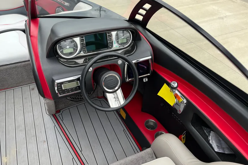 Slide: The Image of Interior of 2013 Malibu Wakesetter 23 LSV boat with steering wheel and dashboard. - 7