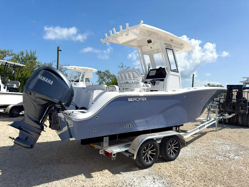 Slide: The Image of 2025 Sea Fox 228 Commander boat on trailer with Yamaha outboard motor. - 2