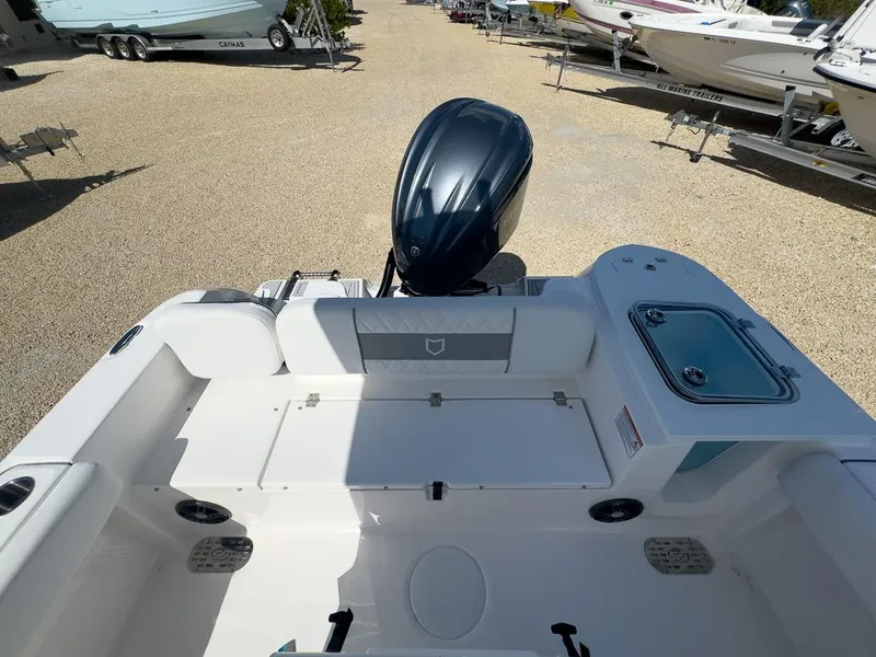 Slide: The Image of 2025 Sea Fox 228 Commander boat with outboard motor in a boatyard. - 9