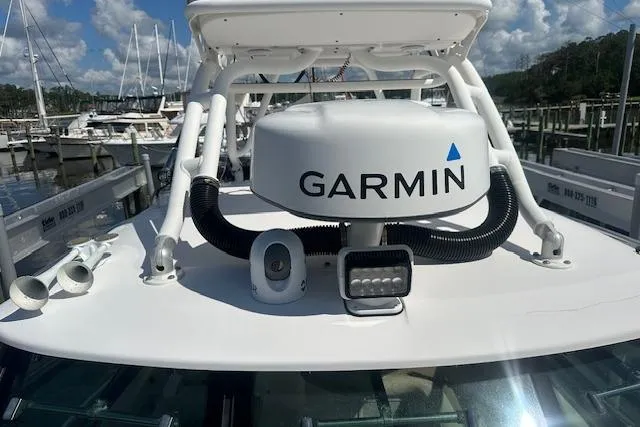 Slide: The Image of 2011 Everglades 320 EX with Tower featuring Garmin radar at marina. - 4