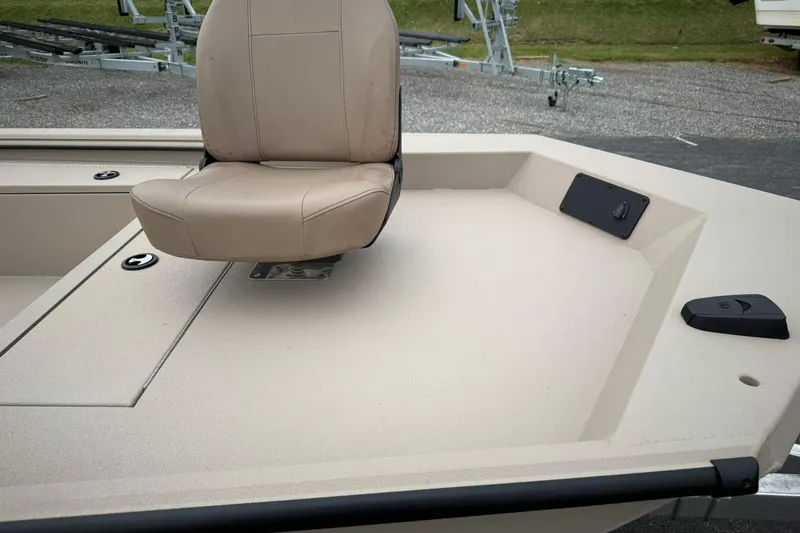 Slide: The Image of 2026 Avid 16 Commander boat with beige seating and deck details. - 5