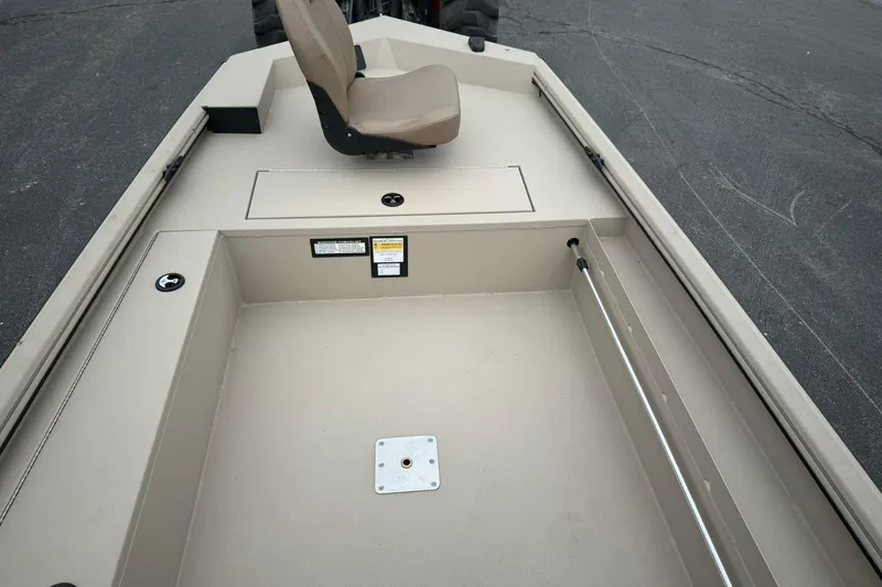 Slide: The Image of 2026 Avid 16 Commander boat interior with seating and storage compartments. - 7