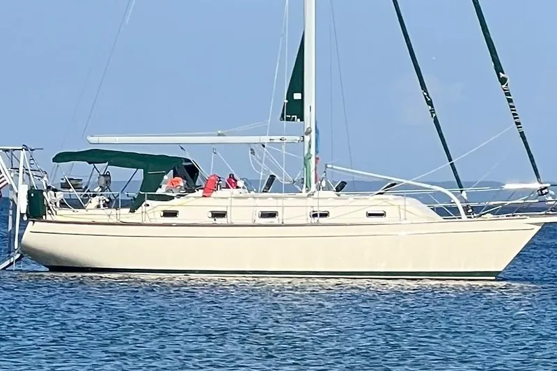 Slide: The Image of Island Packet 380 sailboat from 2000 on calm blue waters. - 0