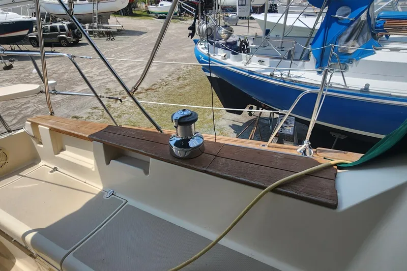 Slide: The Image of Cockpit view of a 2000 Island Packet 380 sailboat in a marina. - 11