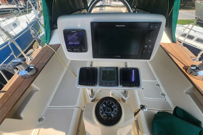 Slide: The Image of Cockpit of 2000 Island Packet 380 sailboat with navigation instruments and compass. - 12
