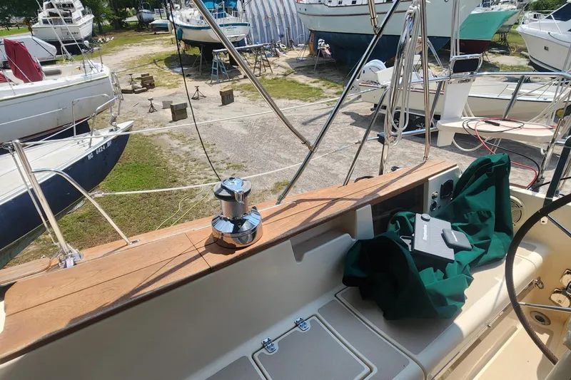 Slide: The Image of Cockpit view of 2000 Island Packet 380 sailboat in a boatyard. - 14
