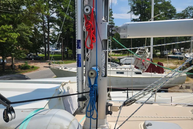 Slide: The Image of Sailboat deck view with rigging, Island Packet 380, 2000 model, in a marina setting. - 18