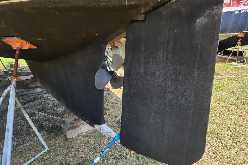 Slide: The Image of Bottom view of 2000 Island Packet 380 sailboat with propeller and rudder visible. - 19