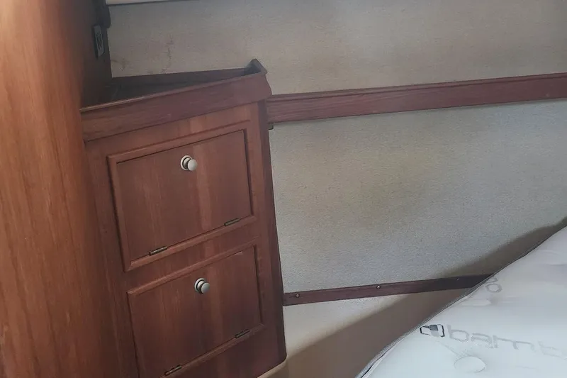 Slide: The Image of Wooden cabinetry and bed in 2000 Island Packet 380 yacht interior. - 26