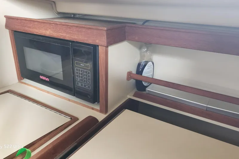 Slide: The Image of Microwave in the galley of a 2000 Island Packet 380 sailboat. - 27