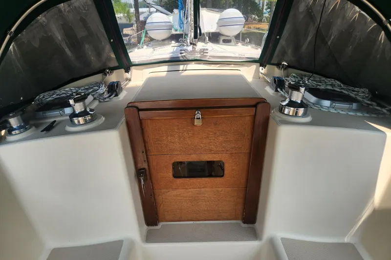Slide: The Image of Cockpit of 2000 Island Packet 380 sailboat with wooden hatch and winches. - 8