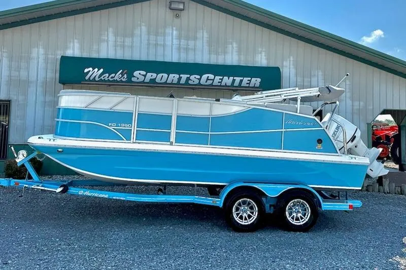 The Image of 2026 Hurricane FD1960RE3-OB boat on trailer at Mack's Sports Center. - 1