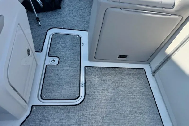 Slide: The Image of Interior view of 2026 Hurricane FD1960RE3-OB boat, featuring sleek flooring and storage compartments. - 11