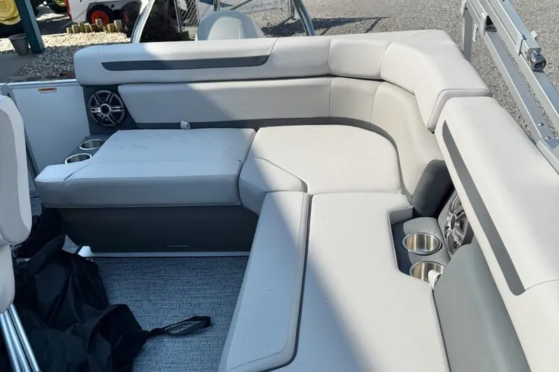 Slide: The Image of Luxurious seating on 2026 Hurricane FD1960RE3-OB boat with cup holders and speakers. - 6