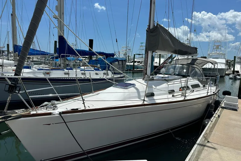 The Image of 2007 Sabre 386 sailboat docked at marina under clear blue sky. - 1