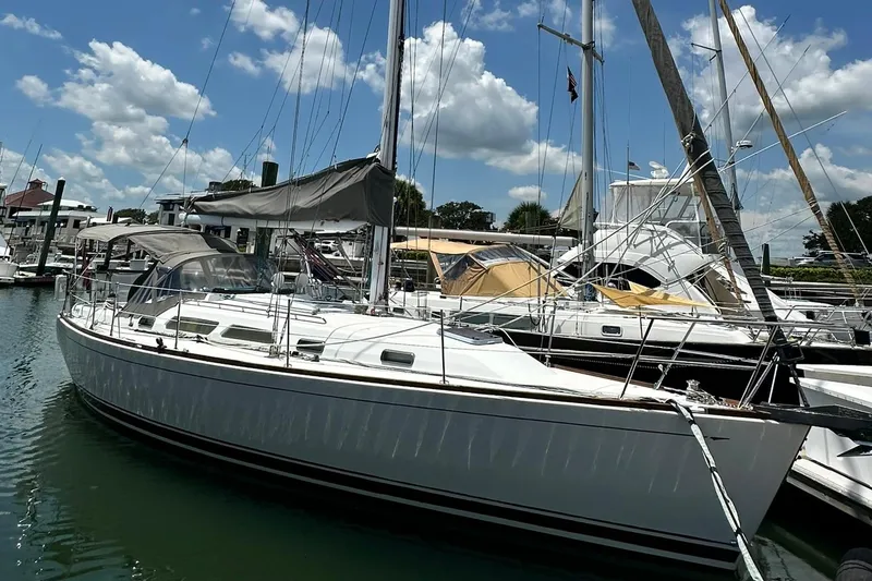 Slide: The Image of 2007 Sabre 386 sailboat docked at marina under blue sky. - 10