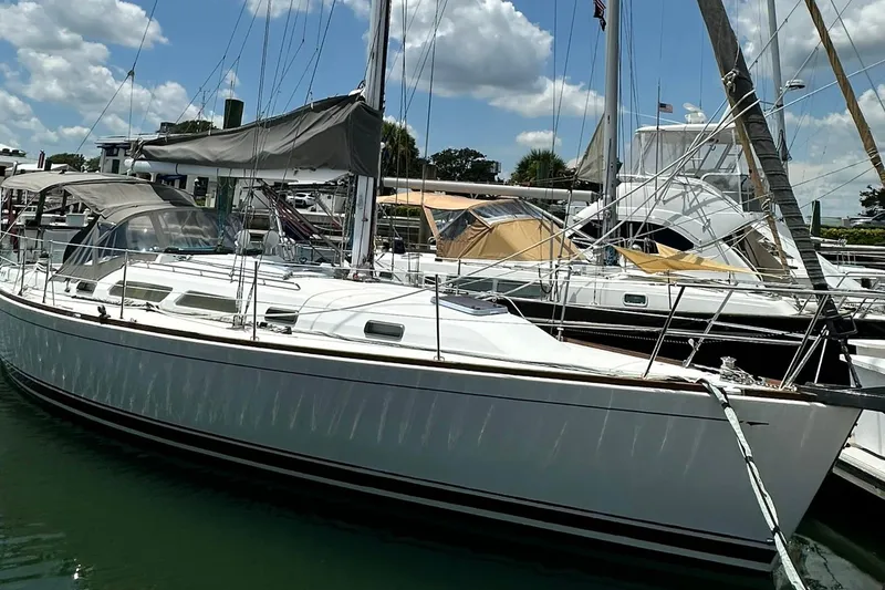 Slide: The Image of 2007 Sabre 386 sailboat docked at marina under a clear blue sky. - 11