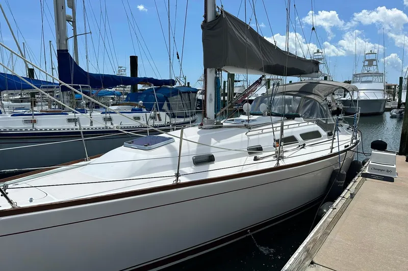 Slide: The Image of 2007 Sabre 386 sailboat docked at marina under clear blue sky. - 12