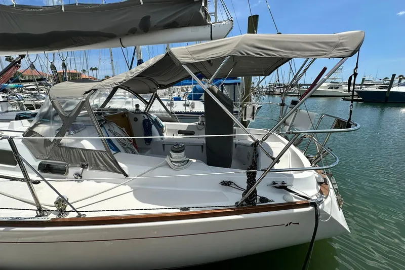 Slide: The Image of Sailboat Sabre 386, 2007 model, docked in a marina with protective canopy. - 15