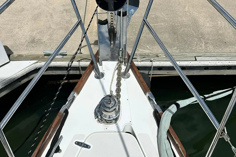 Slide: The Image of Bow of 2007 Sabre 386 sailboat with anchor chain and railing at dock. - 19