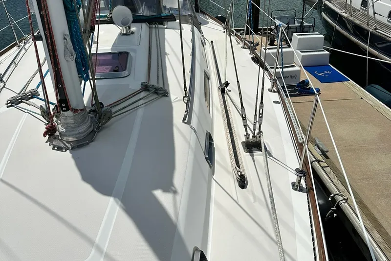 Slide: The Image of 2007 Sabre 386 sailboat deck with rigging and dock view. - 23