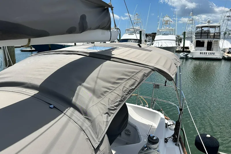 Slide: The Image of Sailboat Sabre 386 (2007) docked in marina with protective canopy. - 27