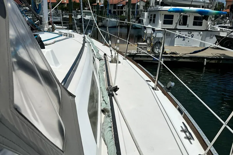 Slide: The Image of 2007 Sabre 386 sailboat docked in marina, featuring sleek deck design. - 28