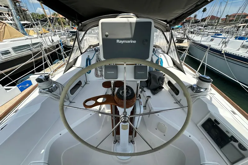 Slide: The Image of Cockpit of 2007 Sabre 386 sailboat with steering wheel and navigation equipment. - 35
