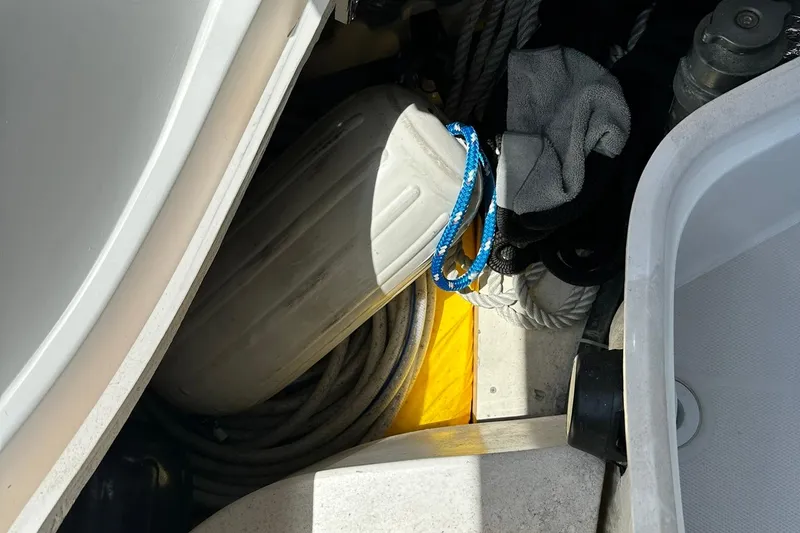 Slide: The Image of Storage compartment on a 2007 Sabre 386 boat with ropes and fender. - 38