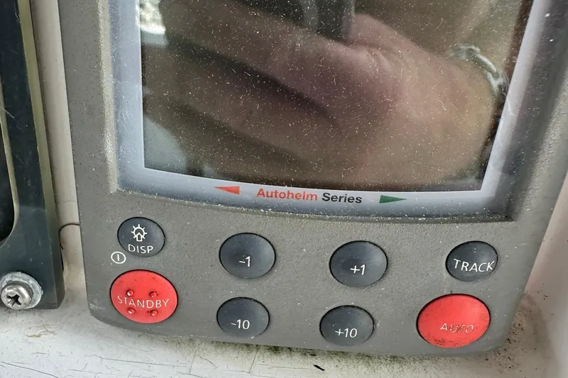 Slide: The Image of Autopilot control panel from a 2007 Sabre 386 yacht, featuring Autohelm Series buttons. - 42