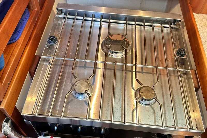 Slide: The Image of Stainless steel stove with three burners on a 2007 Sabre 386 yacht. - 49