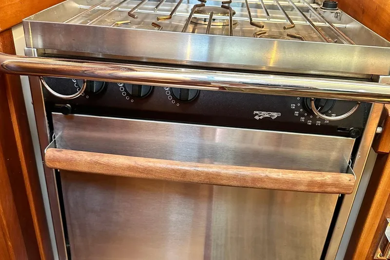 Slide: The Image of Stainless steel oven with wooden handle in a 2007 Sabre 386 yacht kitchen. - 50
