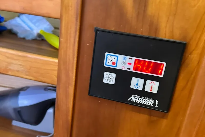 Slide: The Image of Control panel of a 2007 Sabre 386 yacht with digital display and buttons. - 52