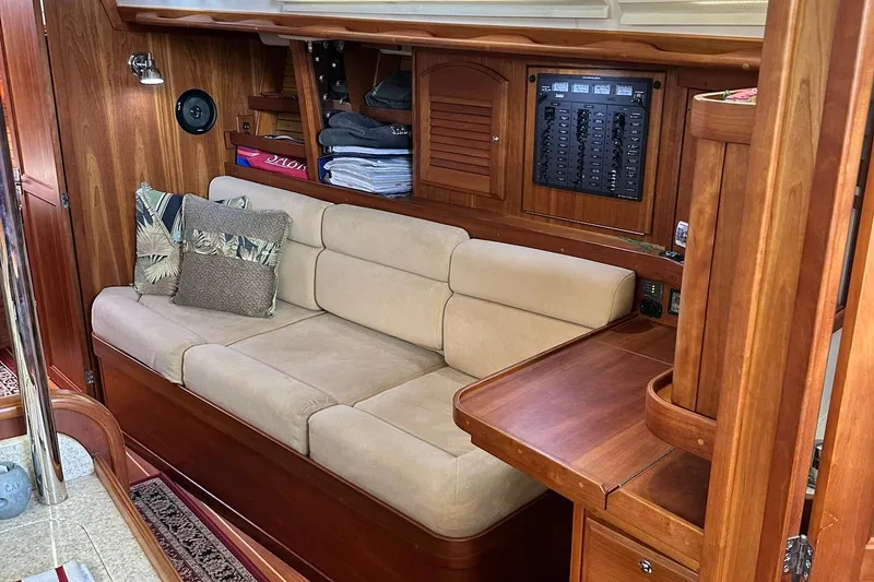 Slide: The Image of Cozy interior of 2007 Sabre 386 yacht with beige sofa and wooden cabinetry. - 57