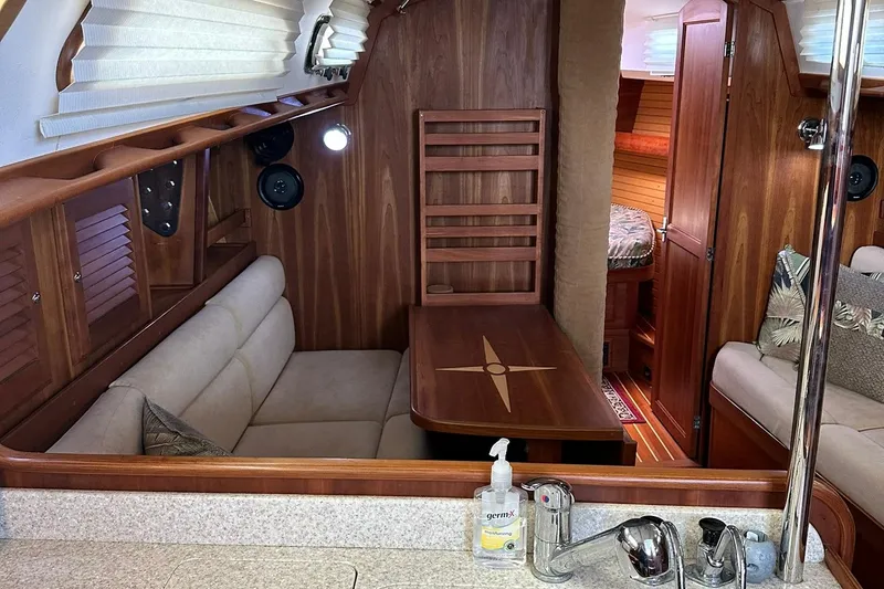 Slide: The Image of Interior of 2007 Sabre 386 sailboat with cozy seating and wooden finishes. - 58