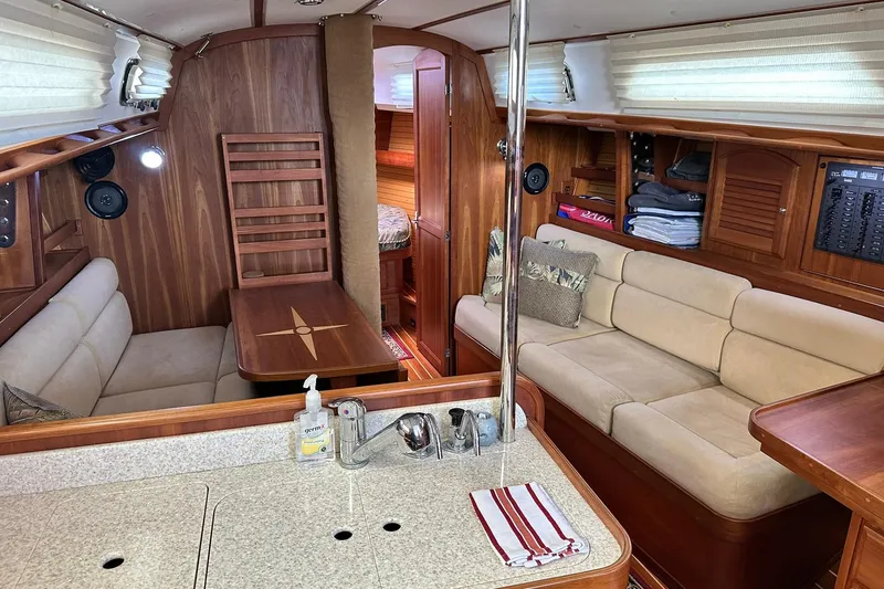 Slide: The Image of Luxurious 2007 Sabre 386 yacht interior with cozy seating and elegant wood finishes. - 59