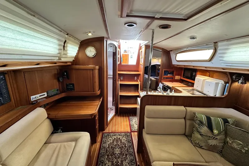 Slide: The Image of Interior of 2007 Sabre 386 sailboat with wood finish and cozy seating area. - 63