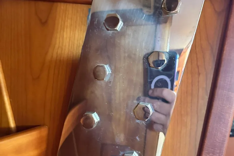 Slide: The Image of Close-up of a reflective metal surface with bolts, Sabre 386, 2007 model. - 68