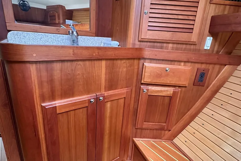 Slide: The Image of Wooden interior of 2007 Sabre 386 yacht with sink and storage cabinets. - 72