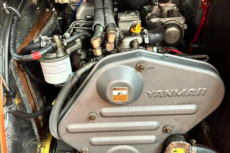 Slide: The Image of Yanmar engine in a 2007 Sabre 386 sailboat, showcasing detailed components. - 73
