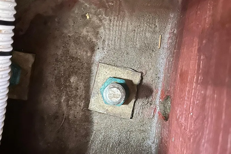 Slide: The Image of Close-up of a bolt on a Sabre 386, 2007 model, with visible corrosion. - 79