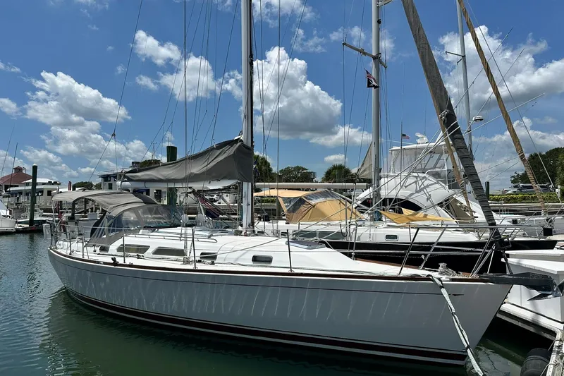 Slide: The Image of 2007 Sabre 386 sailboat docked at marina under blue sky. - 9