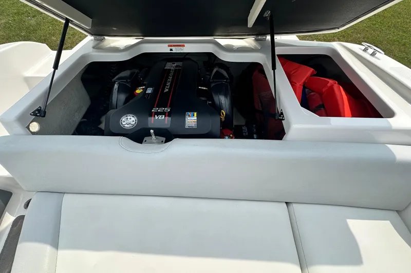 Slide: The Image of Open engine compartment of 2013 Regal 1900 Bowrider boat, showcasing V8 engine. - 6