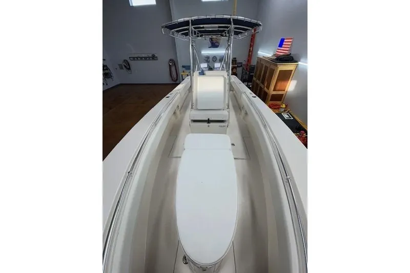 Slide: The Image of 2003 Contender 27 Open boat interior with storage compartment, sleek design, and modern features. - 15