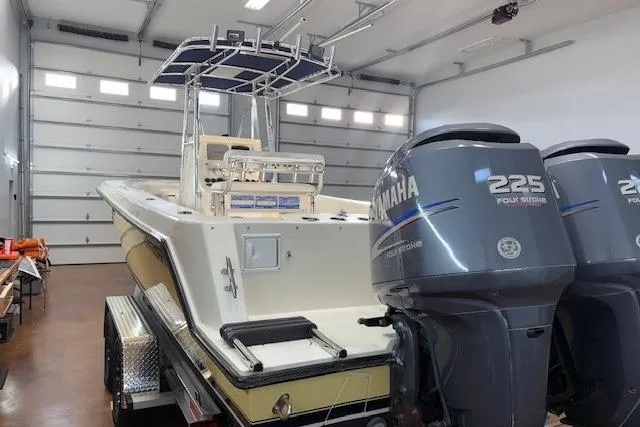 Slide: The Image of 2003 Contender 27 Open boat interior with Frigid Rigid cooler and white seating. - 17